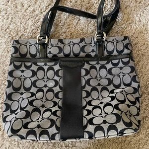 Black and gray Coach purse.